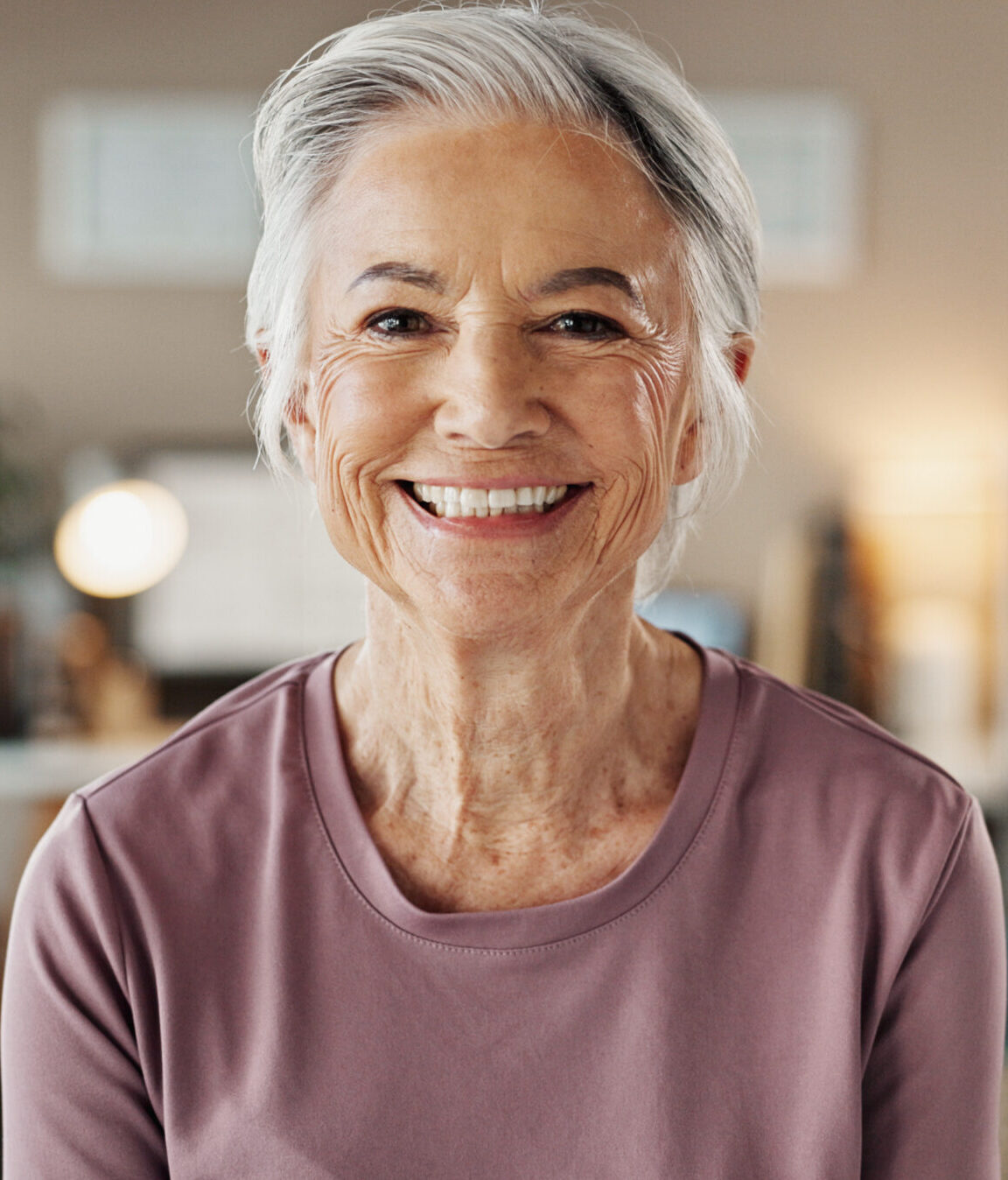 Senior woman, portrait and smile with dental treatment, whitening results and cleaning confidence. Hygiene, mouth health and cosmetics for dentures, oral care and satisfaction for teeth aesthetic.