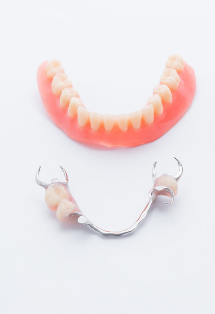 Set of dentures on white background