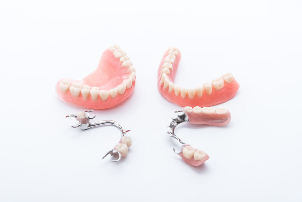 Set of dentures on white background