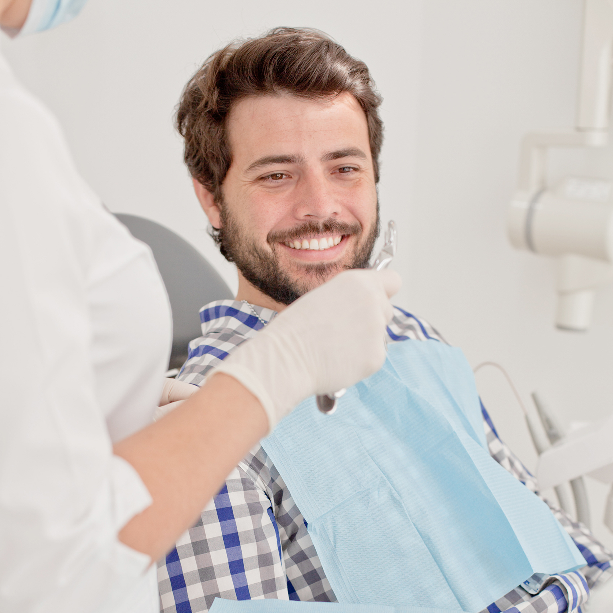 young man and woman in a dental examination at dentist
