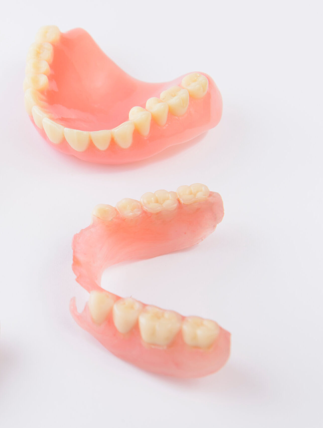 Group of dentures on white background