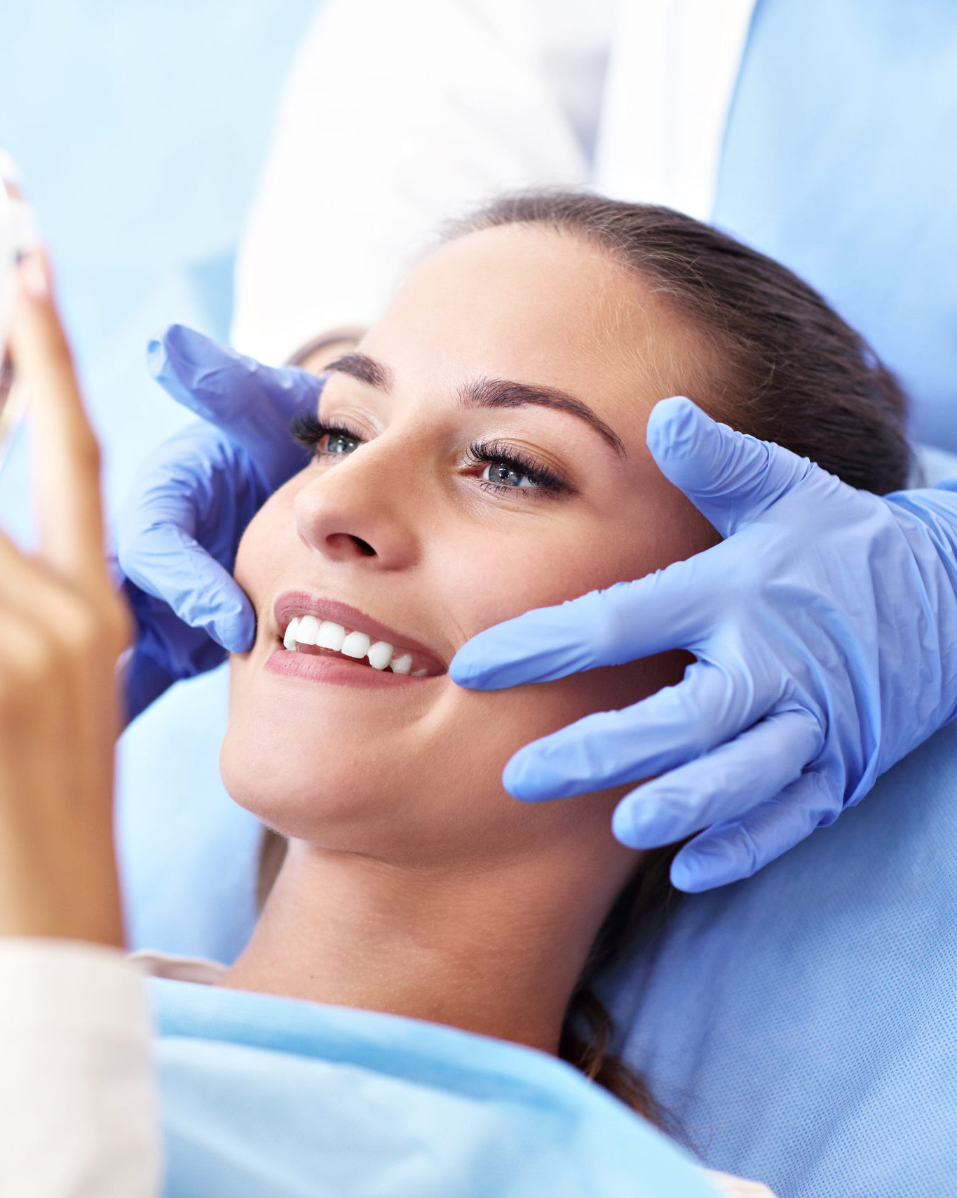 Picture of adult woman having a visit at the dentist's