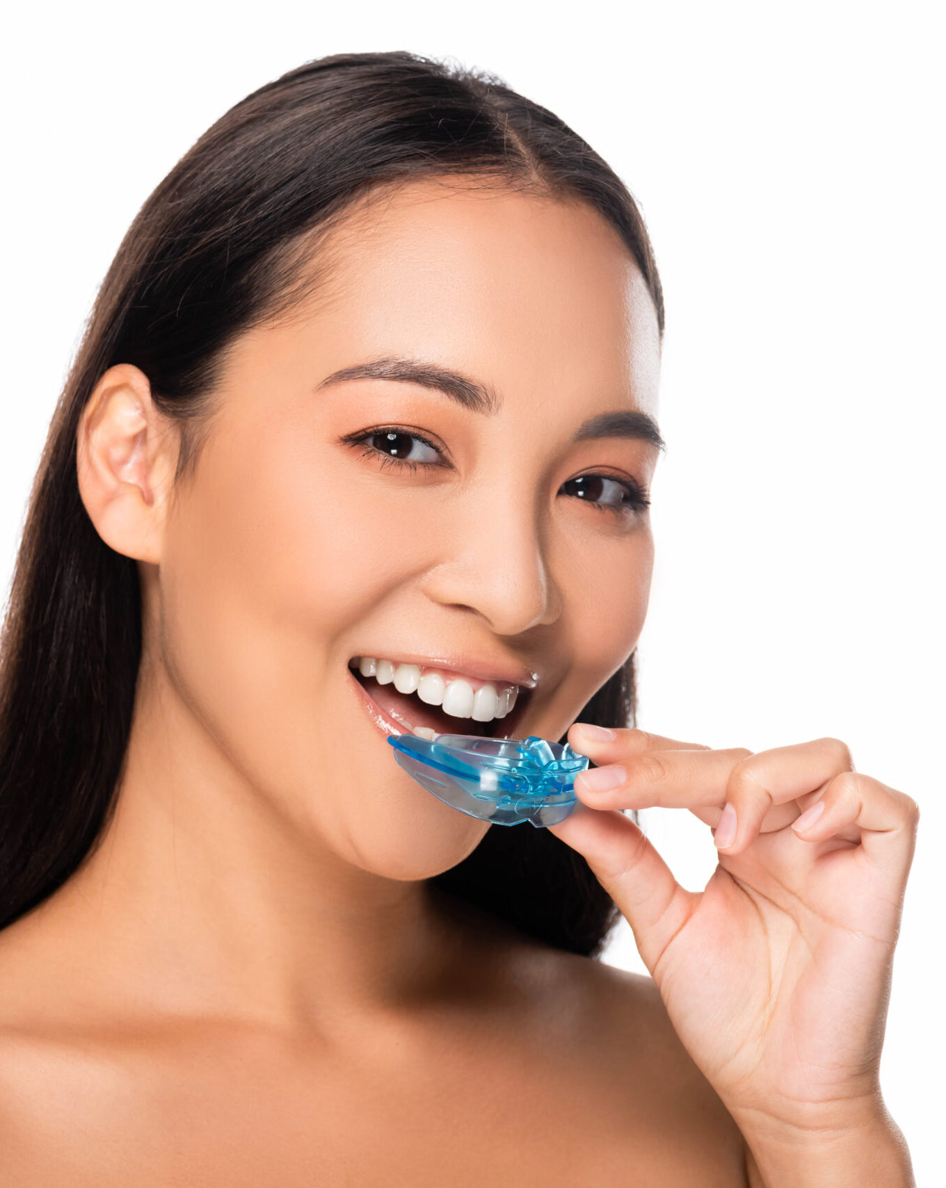 happy naked asian woman holding mouth guard isolated on white
