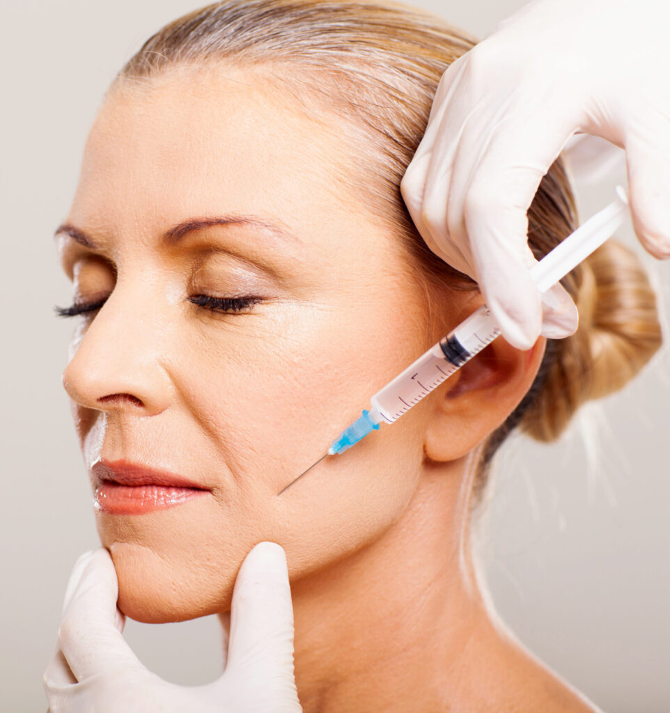 senior woman doing face lifting on her cheek