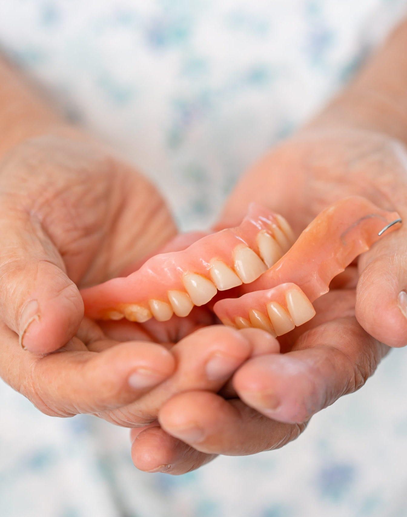 Asian elderly woman patient holding to use denture, healthy strong medical concept.