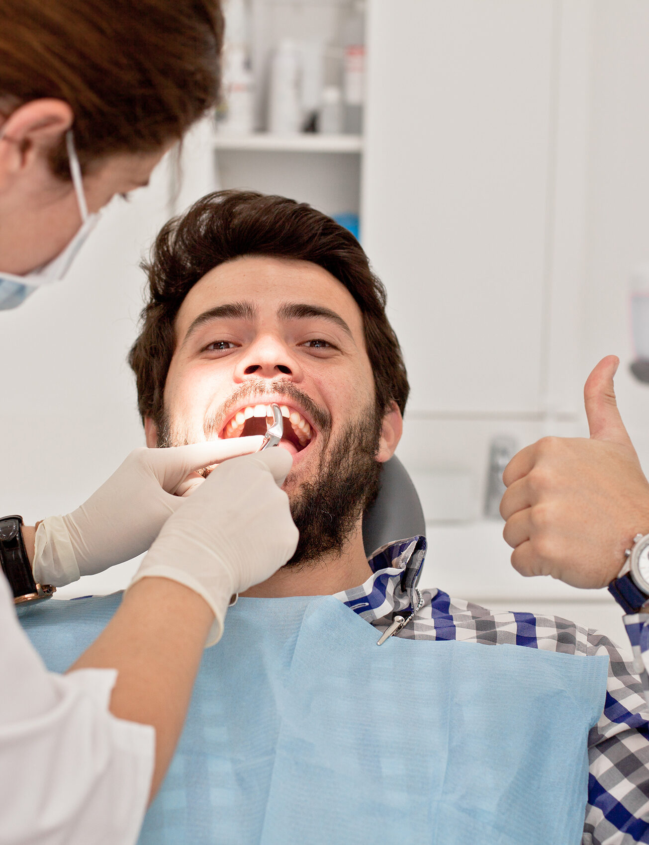 young man and woman in a dental examination at dentist